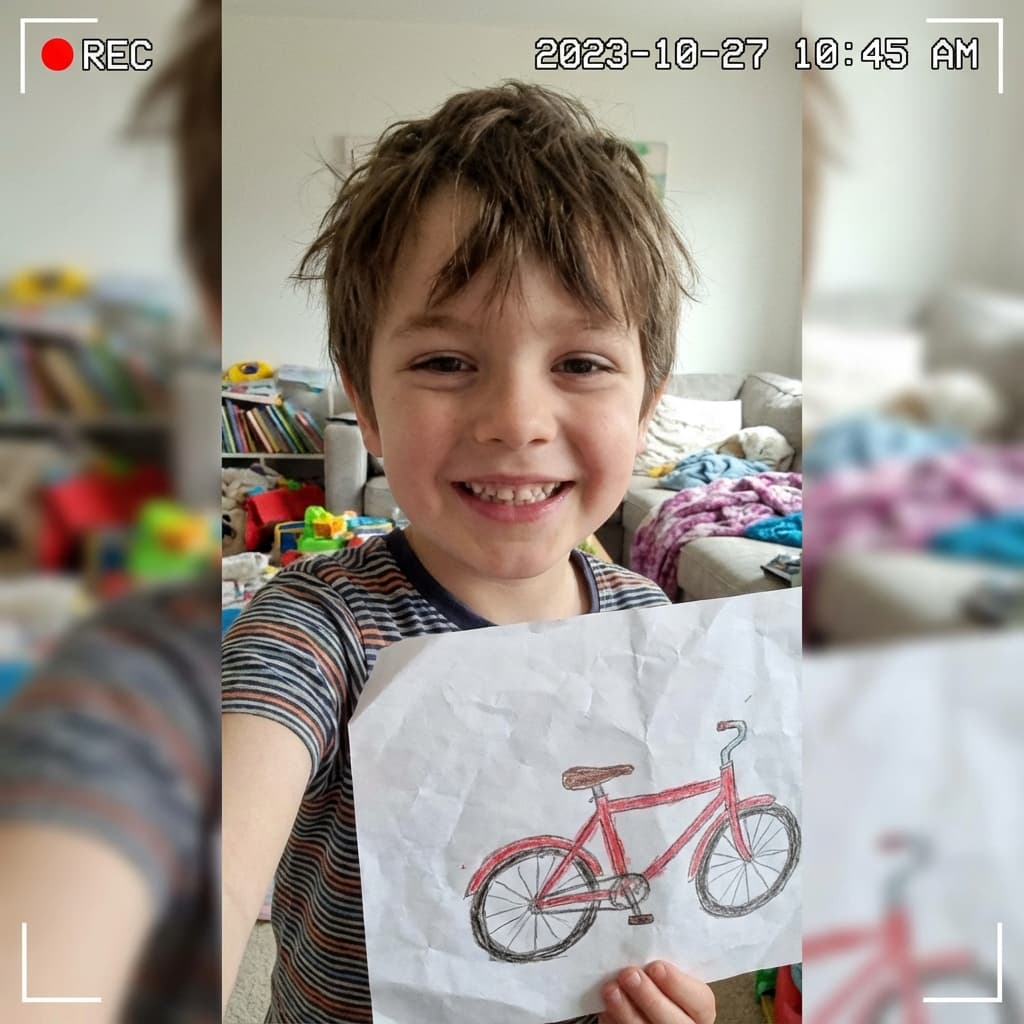 Child showing their wishlist drawing